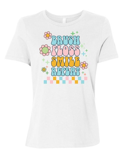 Groovy "Brush, Floss, Smile, Repeat" graphic Women's fit premium crewneck tee White