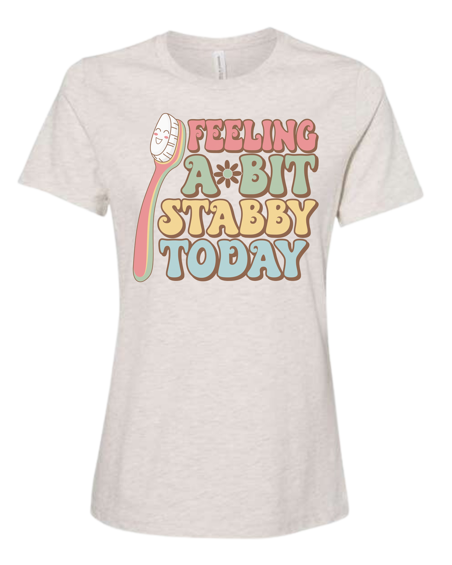 Groovy font "Feeling a bit Stabby" with large toothbrush graphic Women's fit premium crewneck tee Natural