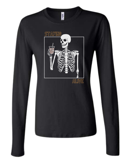 "Staying Alive" skeleton holding a coffee cup Women's fit crewneck long sleeve fit Black